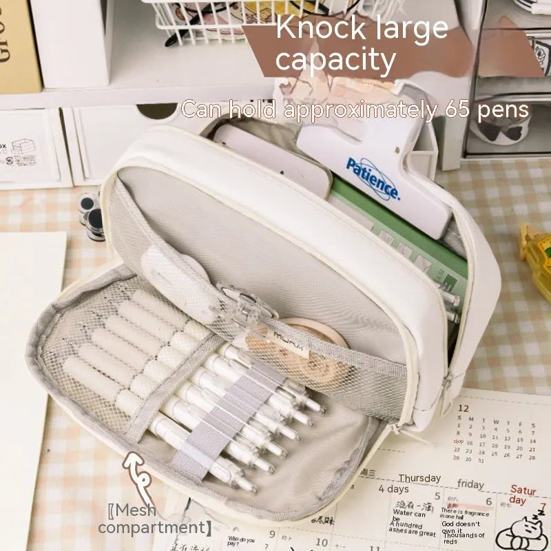 Large capacity Korean-style canvas pencil case for girls in green, holding multiple pens.