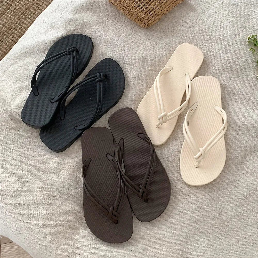 Women's pink flip flops with toe-covering design and non-slip PVC sole for summer outdoor wear