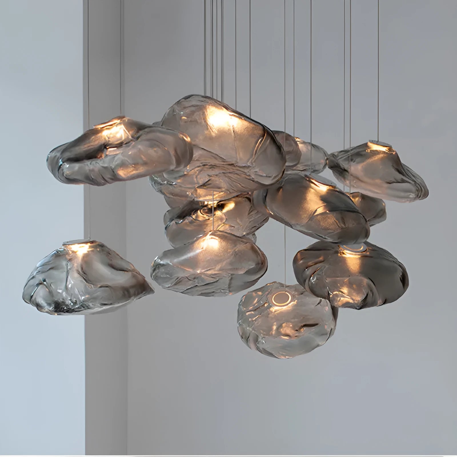 Modern glass chandelier with fabric accents in clear, amber or smoke grey colour options