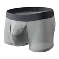 Men's solid colour ice silk mesh boxer underwear on a grey background, showing low waist design.
