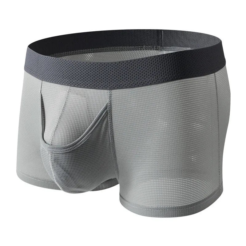 Men's solid colour ice silk mesh boxer underwear on a grey background, showing low waist design.