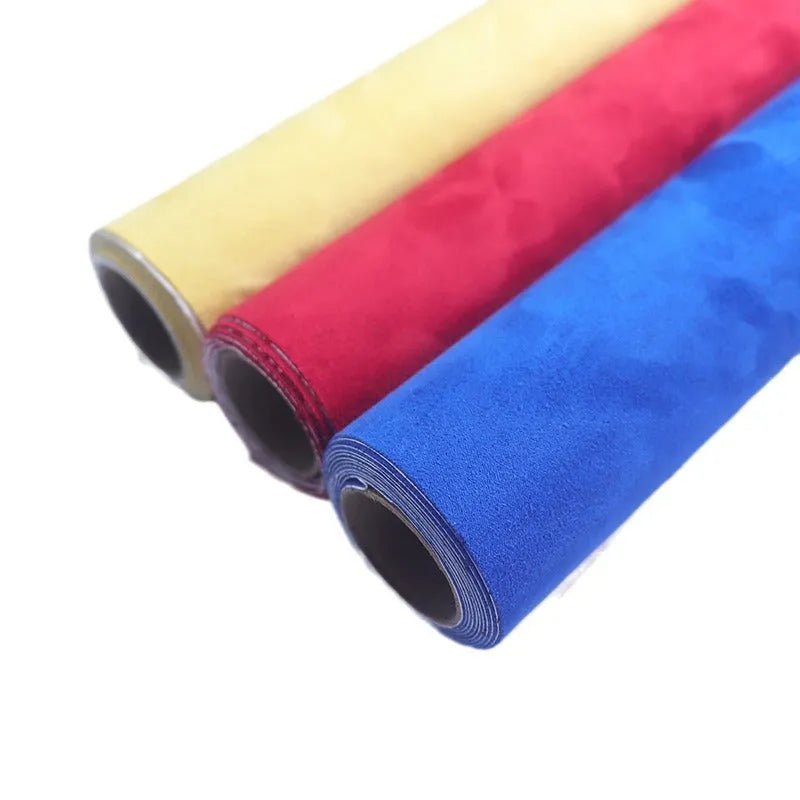 Rolls of self-adhesive suede leather in multiple colours including black, brown, blue, and red.