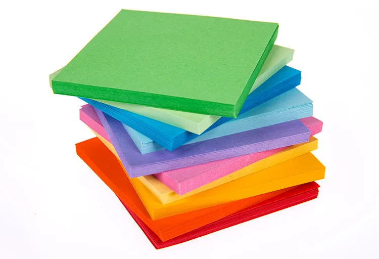 Assorted colourful mini paper scrolls with central metal eyelets for drift bottle messages.