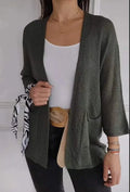 Women's army green waffle knit cardigan coat with nine-quarter sleeves and pockets laid flat.