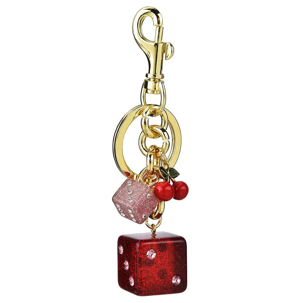Square metal keychain pendant with a vintage cherry two-colour dice design.