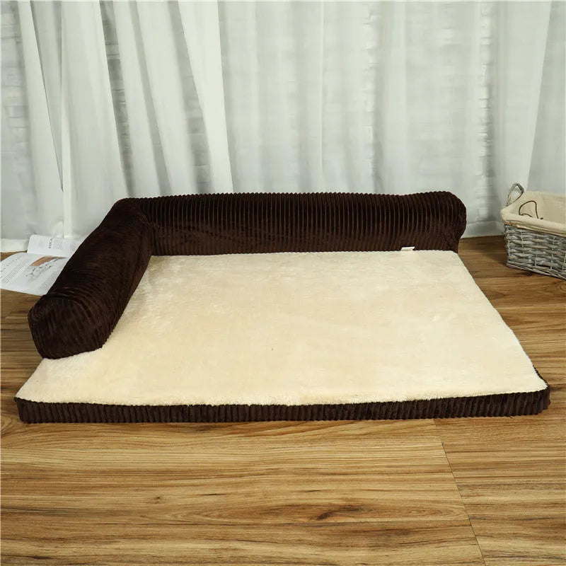 Corduroy dog sofa bed with bolster, shown in grey, placed on a wooden floor.