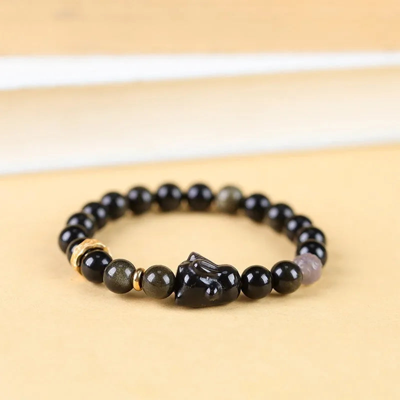 Handmade lying rabbit charm obsidian bracelet with grey agate beads in 8mm and 10mm sizes.