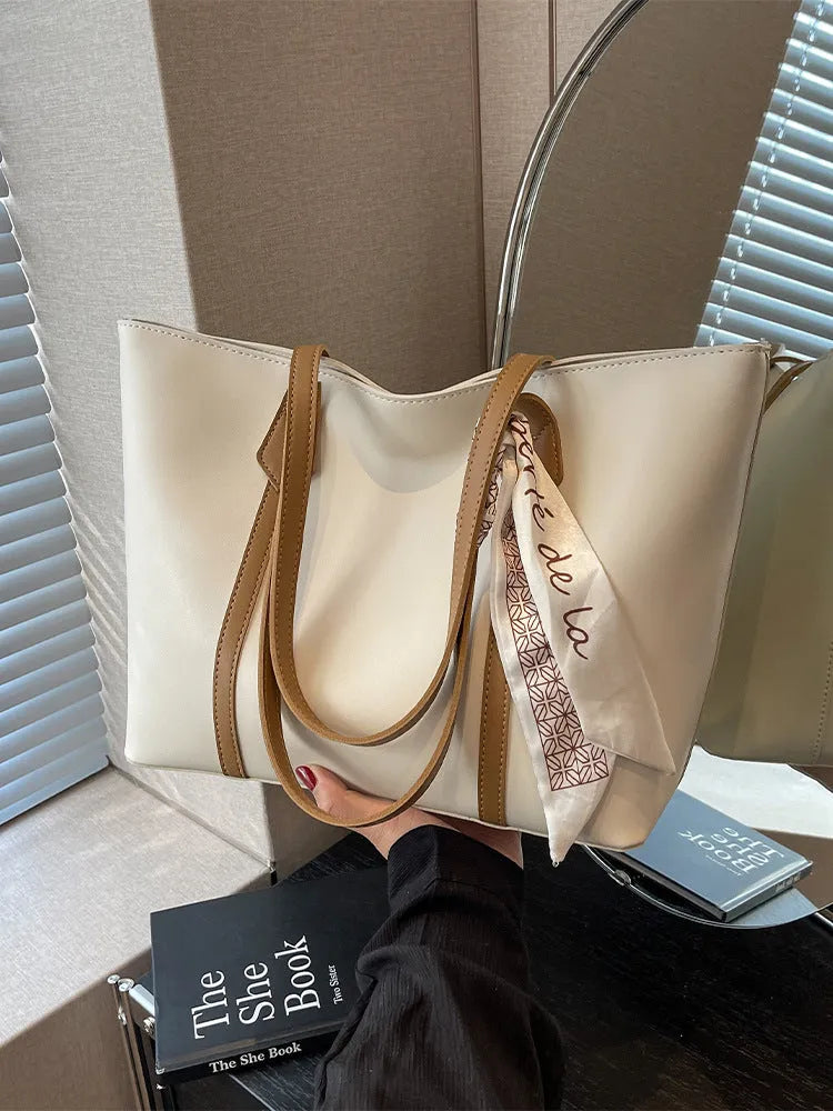 Casual tote bag with bucket fashion design in available colour combinations showing shoulder and crossbody carry options