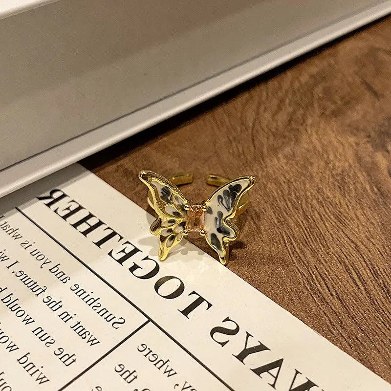 Butterfly women's copper ring with adjustable split ring design showing oil-drip colour treatment