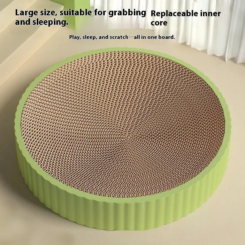 Green round corrugated cardboard cat scratching board measuring 55cm with two replacement pads.
