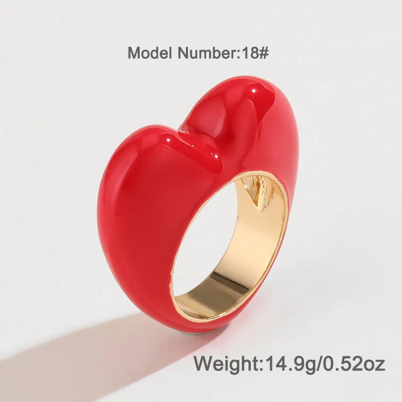 Three-dimensional heart-shaped enamel ring in a choice of colours on a zinc alloy band.