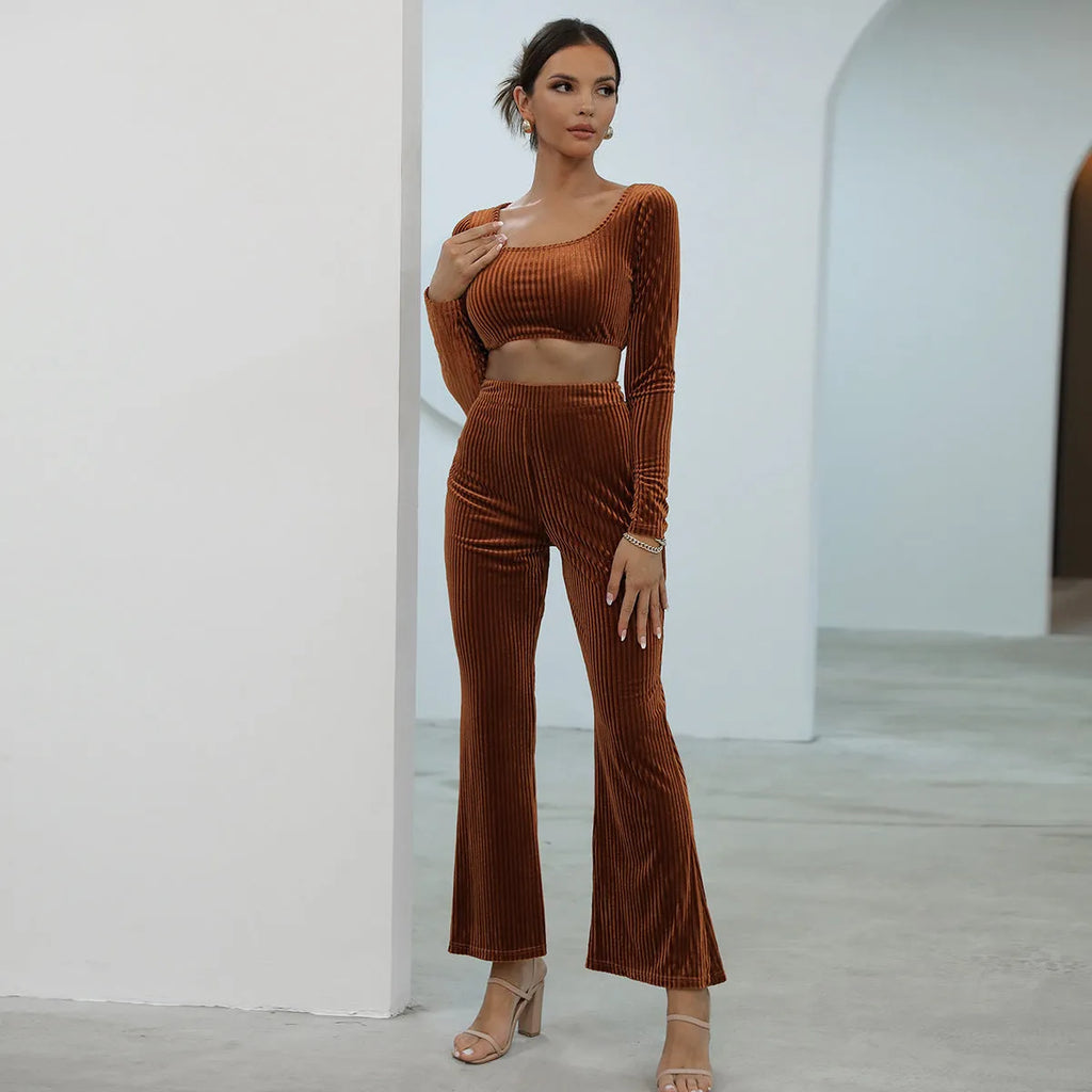 Caramel coloured women's long sleeve sweater set with matching trousers on a hanger.