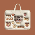 Inflatable PU leather laptop bag with cartoon print hanging from a suitcase handle