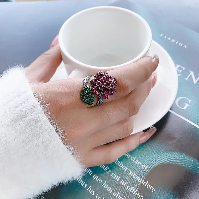 Black gold geometric flower ring with diamond-treated simulation red corundum stone