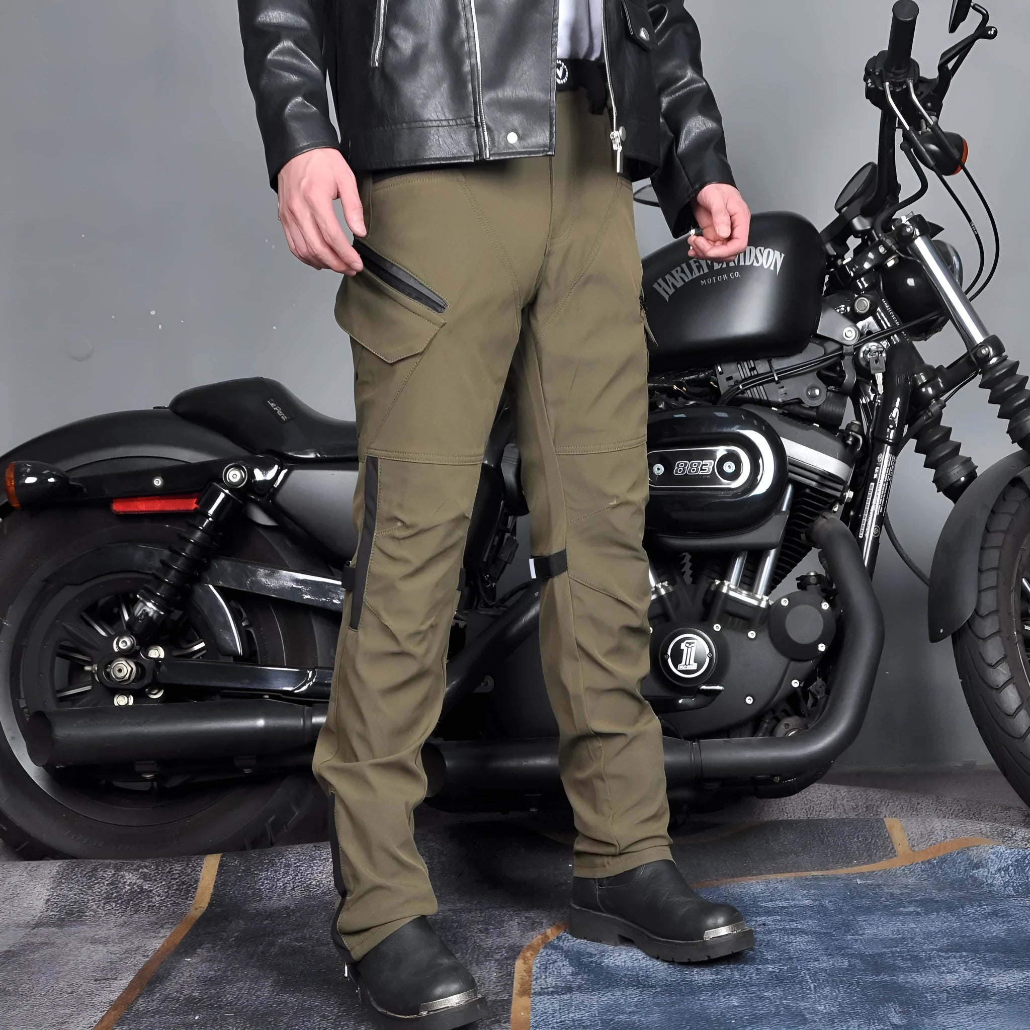 Men's black waterproof motorcycle cycling trousers with protective gear on a mannequin