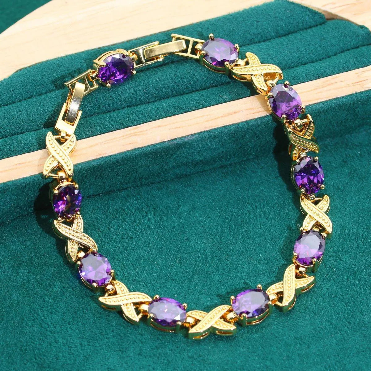 18k gold plated jewellery set with ring, earrings, bracelet and necklace featuring coloured zircon stones.