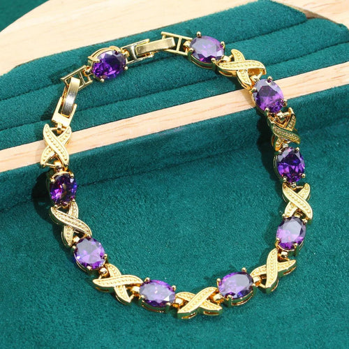 18k gold plated jewellery set with ring, earrings, bracelet and necklace featuring coloured zircon stones.