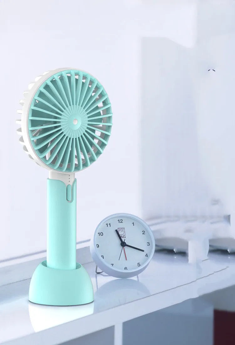 Blue USB-powered mini handheld fan with three-speed control and compact design