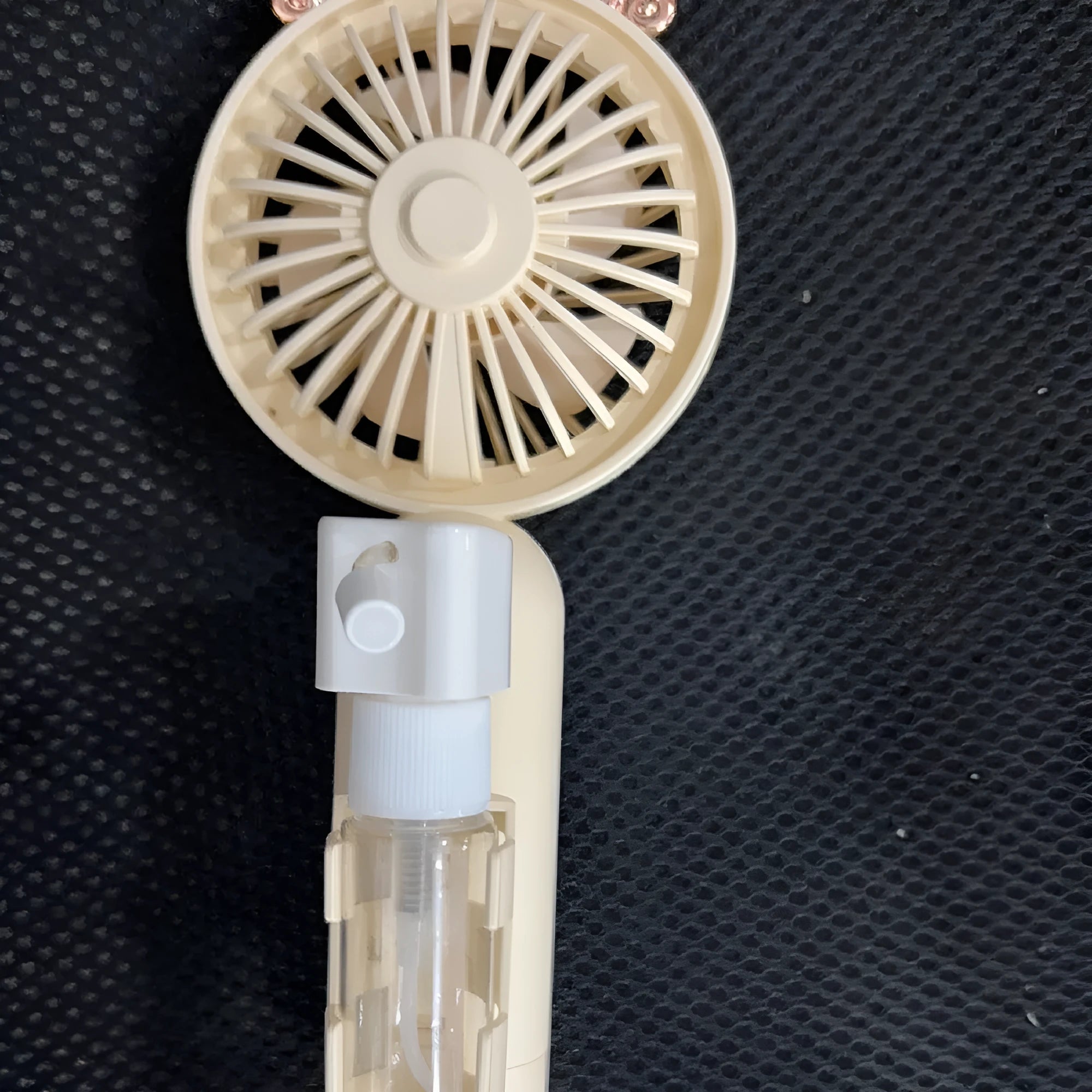 Personalised plastic USB rechargeable nozzle fan in apricot, blue, green, orange, or pink colour on a white background.