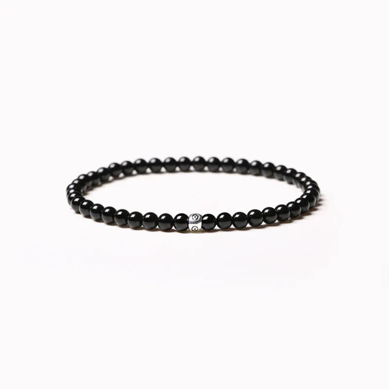 Unisex fine Obsidian Agate Blue San bracelet with electroplated finish and cut surface beads.