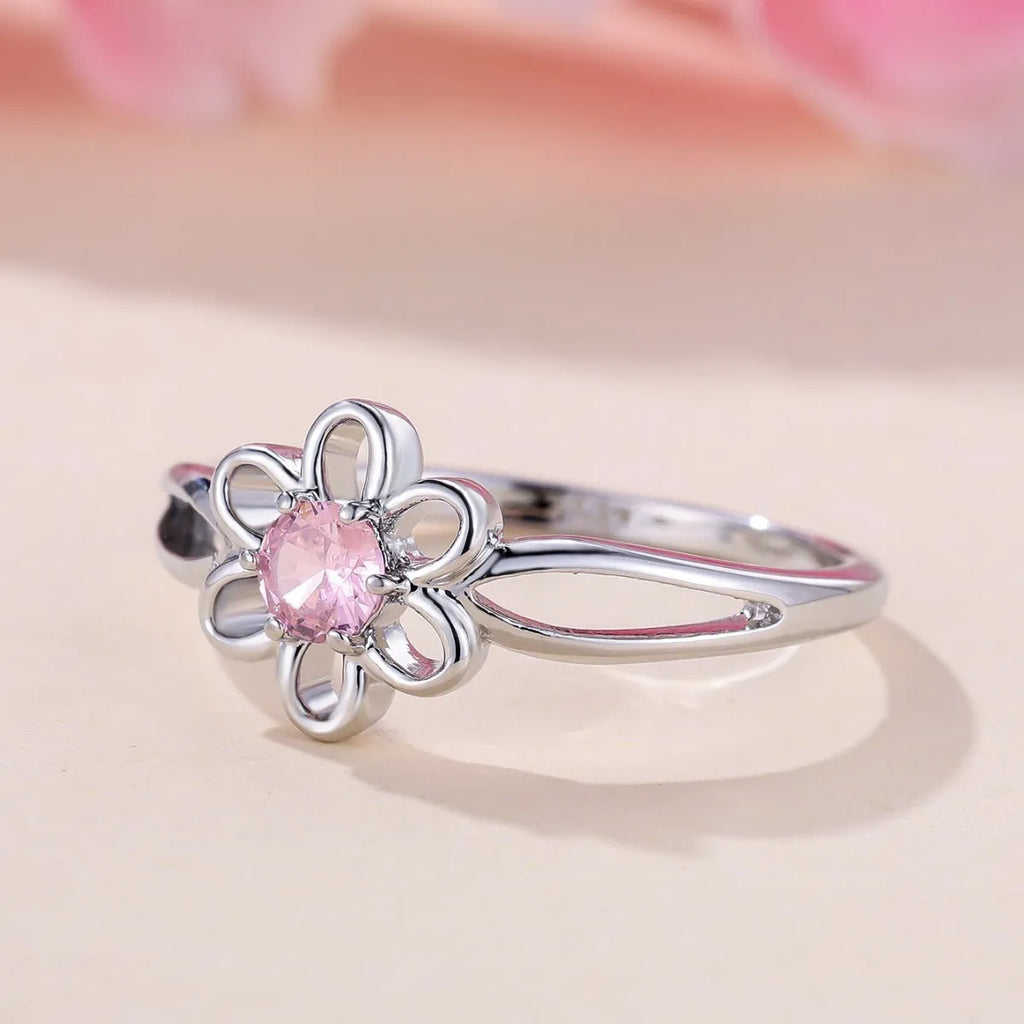 Women's floral hollowed fashion ring in electroplated finish showing flower design detail
