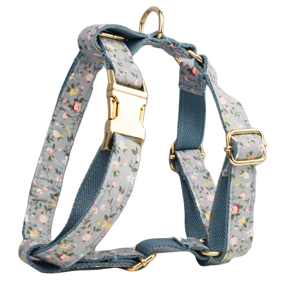 Blue floral patterned cloth dog collar with matching leash, vest, bow, and poop bag set for pet gifts
