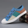 Men's low-top canvas sneaker with elastic band closure in beige colour with contrast stitching.