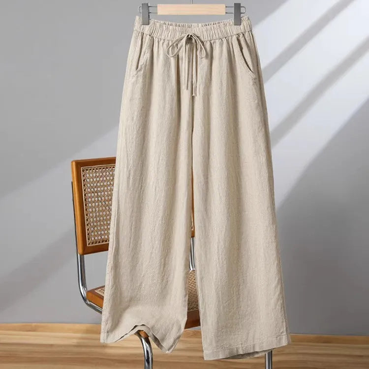 Women's straight-leg casual trousers with an elastic drawstring waist, shown in apricot colour.
