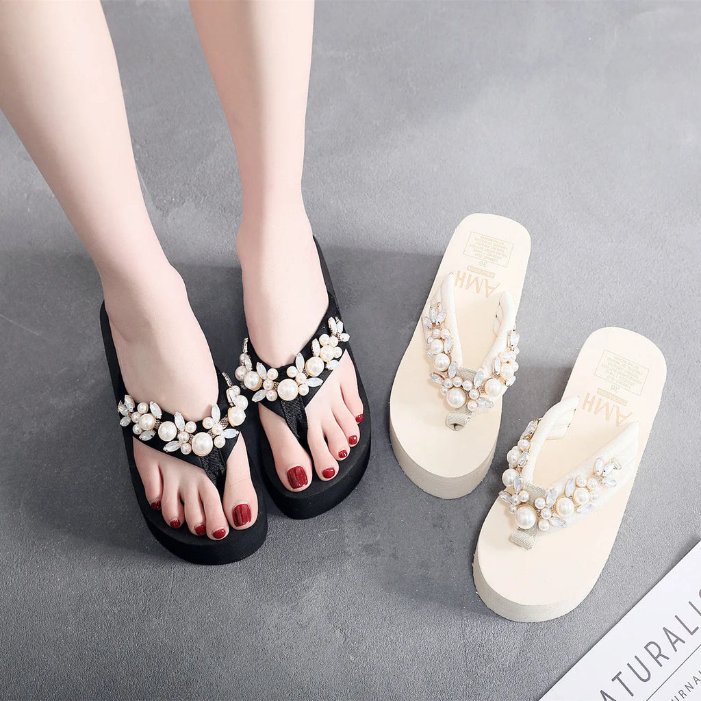 Women's black cotton high-heeled flip-flops on a white background