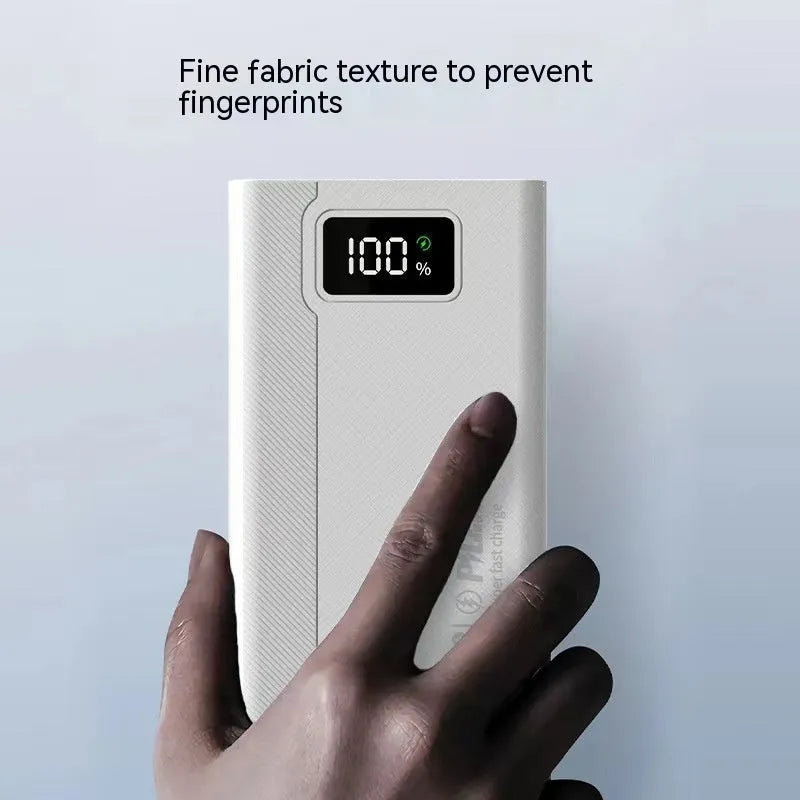 Black and white large capacity power bank with fast charging, showing size comparison