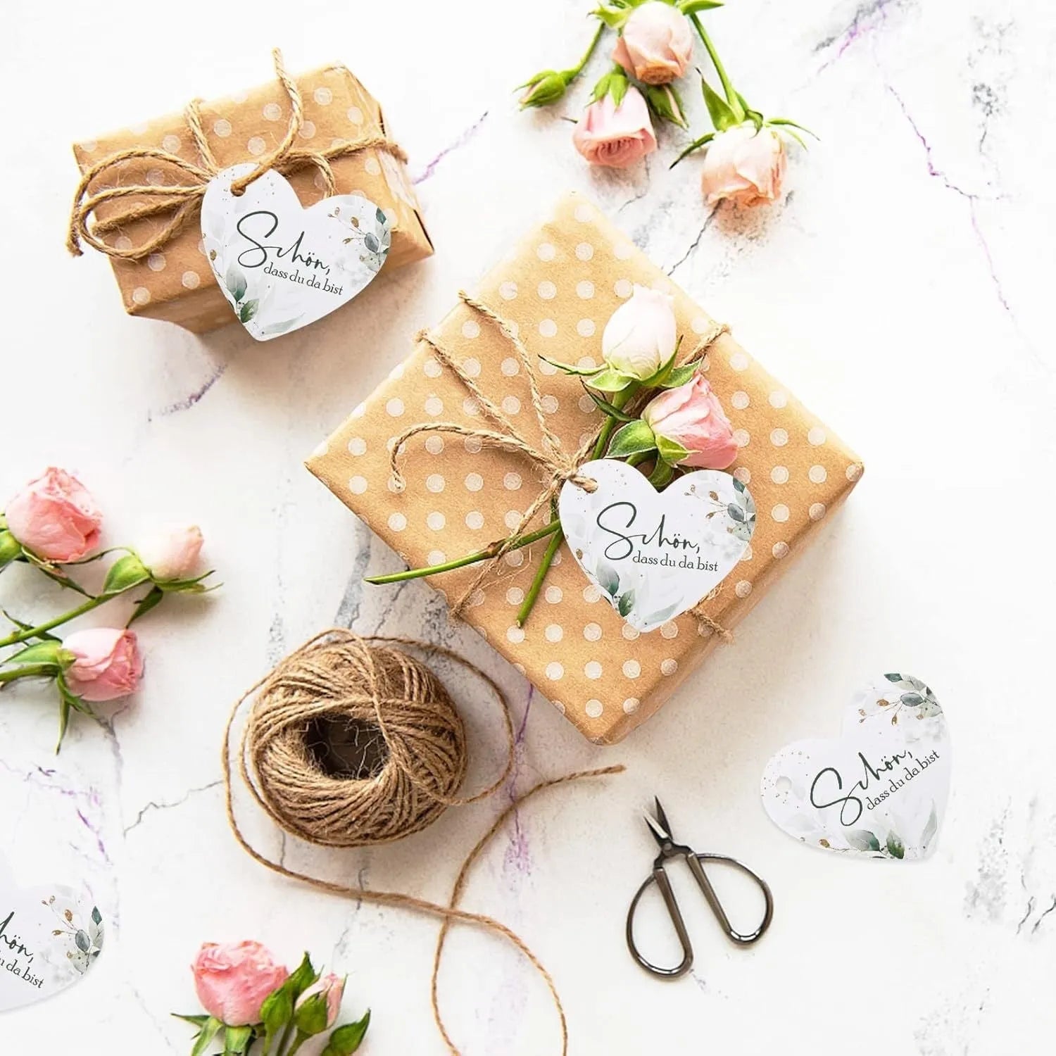 Pack of 50 floral design heart-shaped paper gift tags in two colour style options.