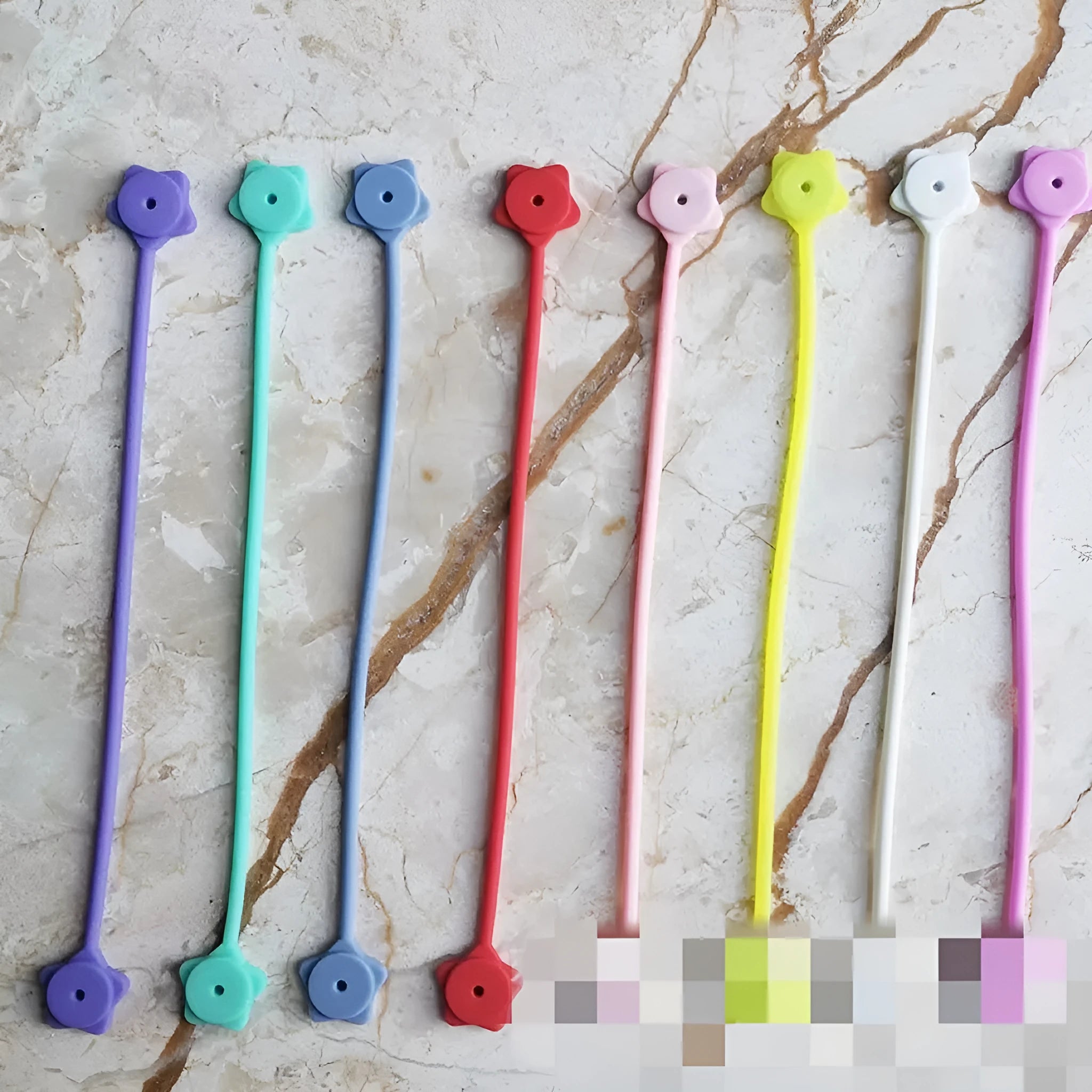 Star-shaped silicone magnet wire winder for organising phone and headphone cables in various colours