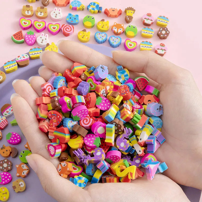 Assortment of 50 colourful miniature cartoon erasers including fruit, animal and theme designs.
