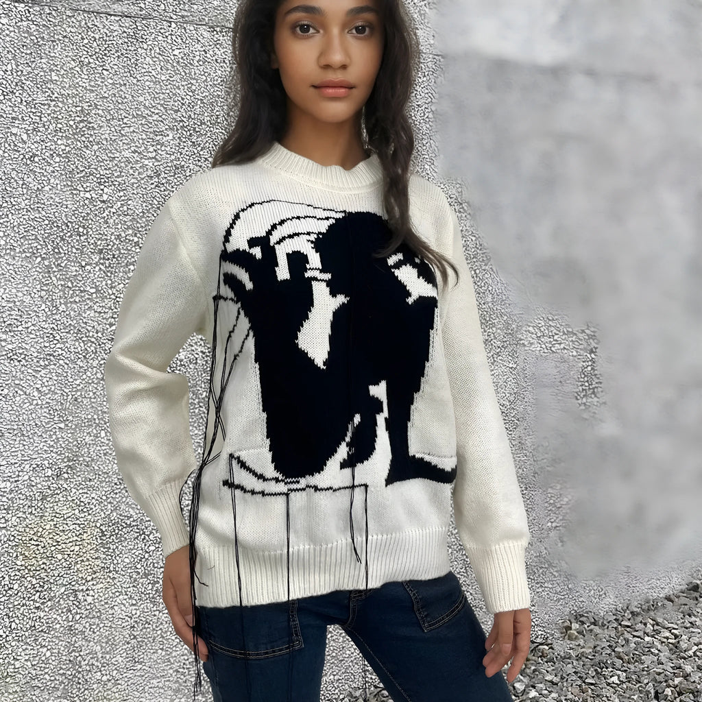 Women's loose grey alpaca wool sweater with tassel detailing and abstract pattern
