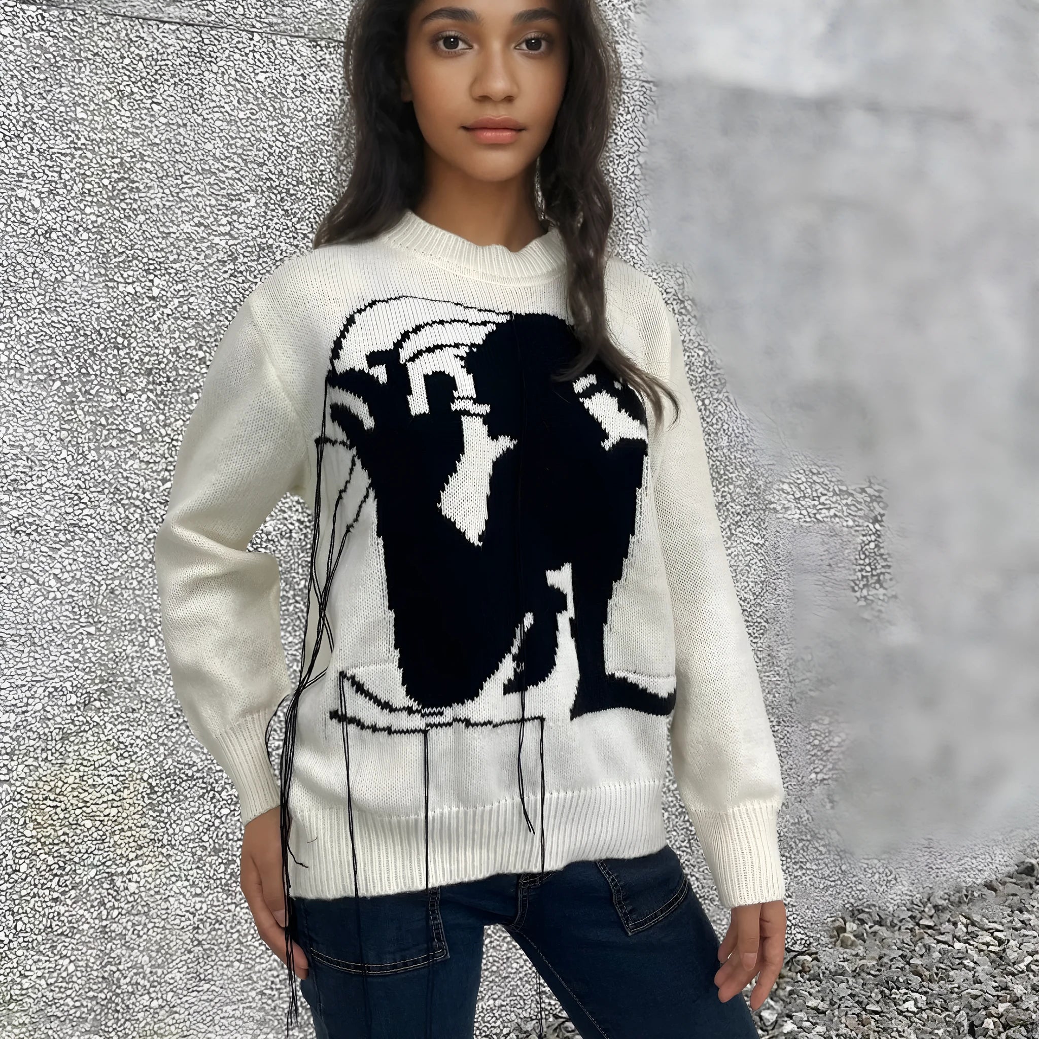 Women's loose grey alpaca wool sweater with tassel detailing and abstract pattern