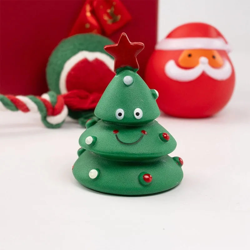 Christmas dog chew toys set with vinyl Santa heads, trees, and festive shapes in gift packaging