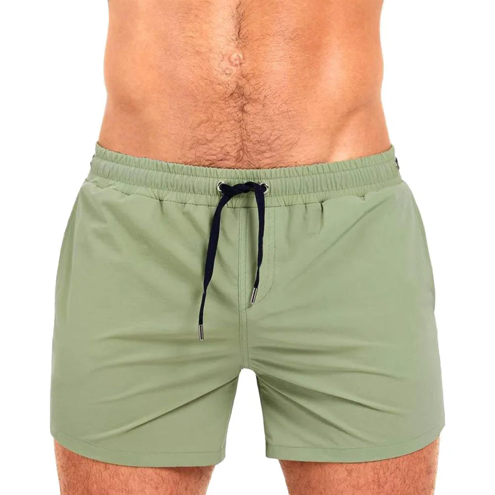 Polyester sports shorts with mesh lining in Army Green colour on size chart