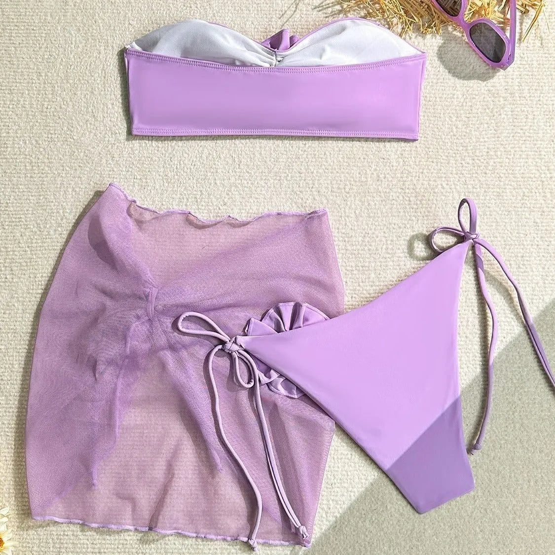 Women's pink tube top swimsuit with three-dimensional flower tied design, matching high-waist shorts and skirt