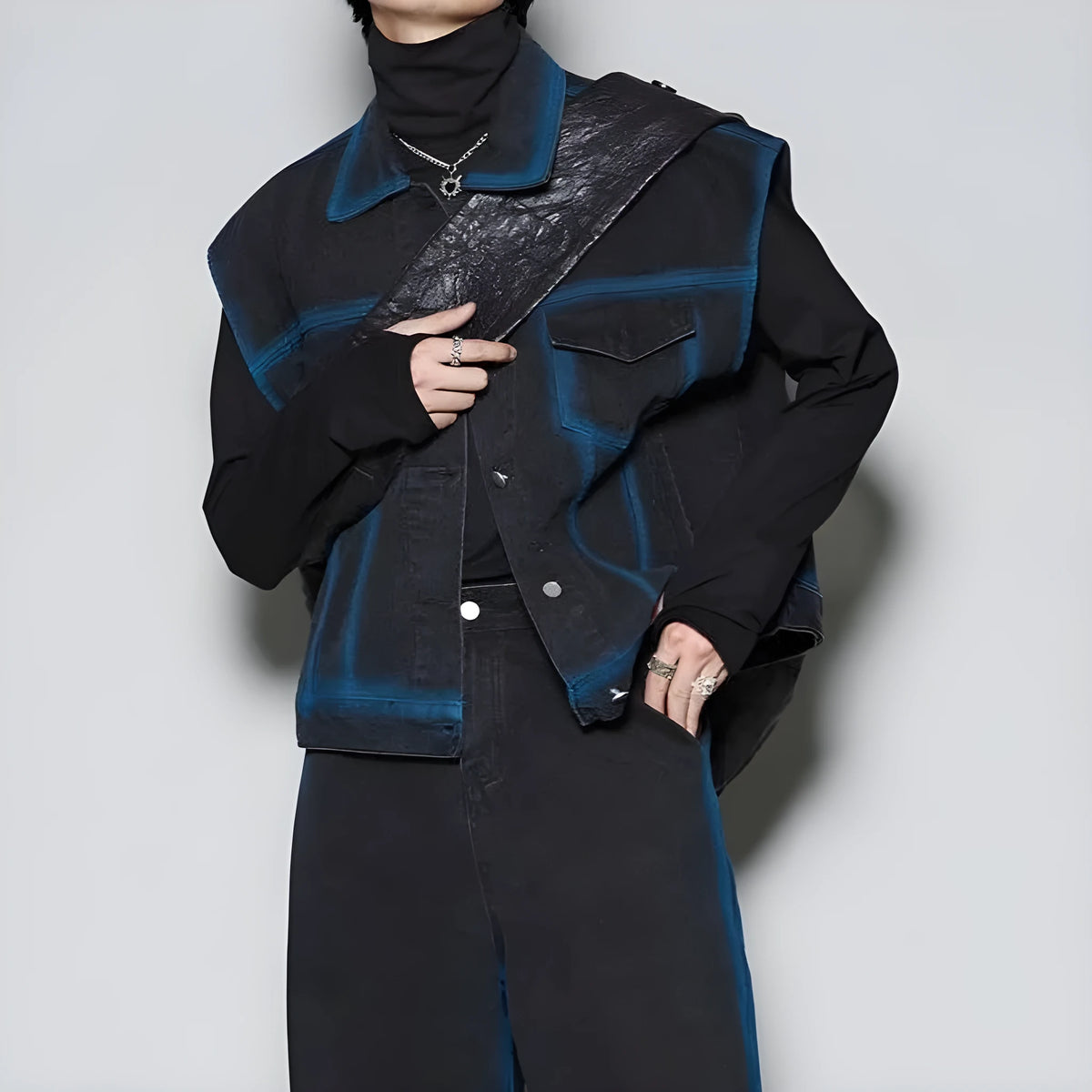 Blue distressed jeans and a matching fleece-lined sleeveless vest from a spray gradient two-piece suit set.