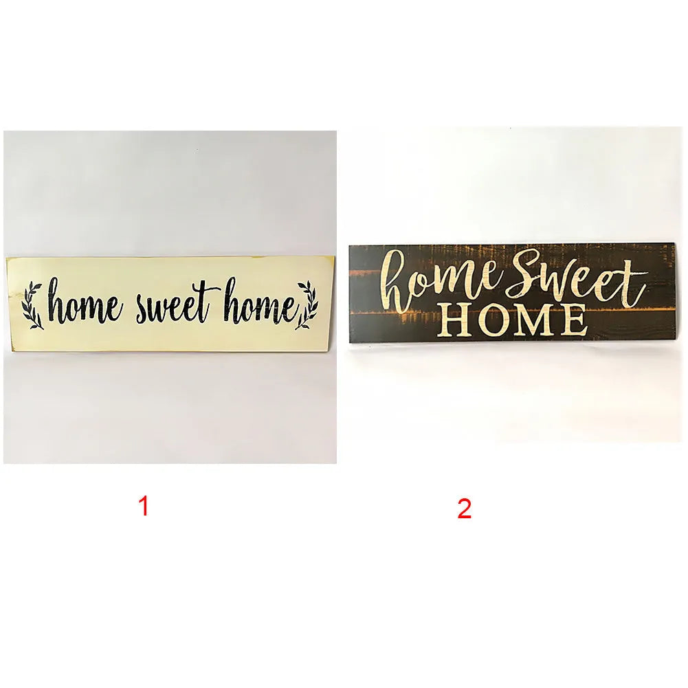 Black wooden wall plaque with carved white HOME SWEET HOME text, showing its rectangular shape.
