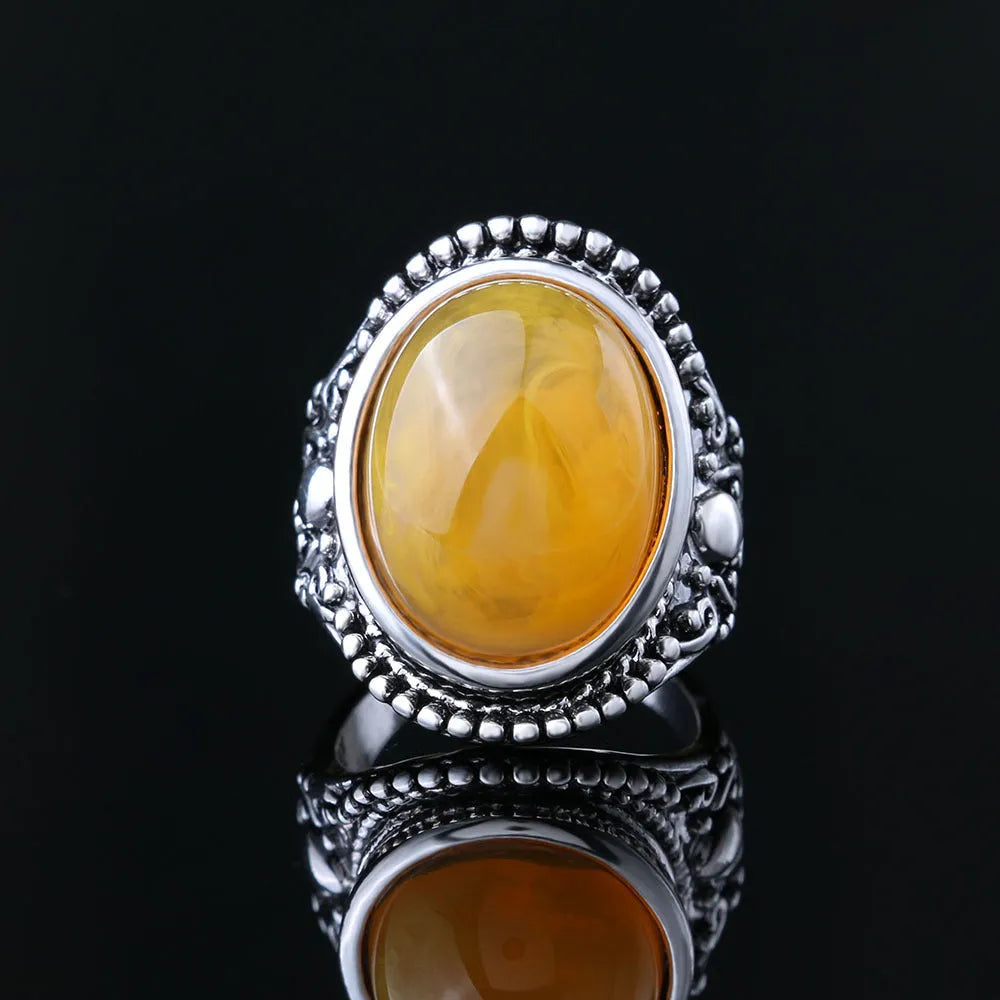 Retro geometric alloy ring with fluorescent beeswax and antique silver plating, shown in size 10.