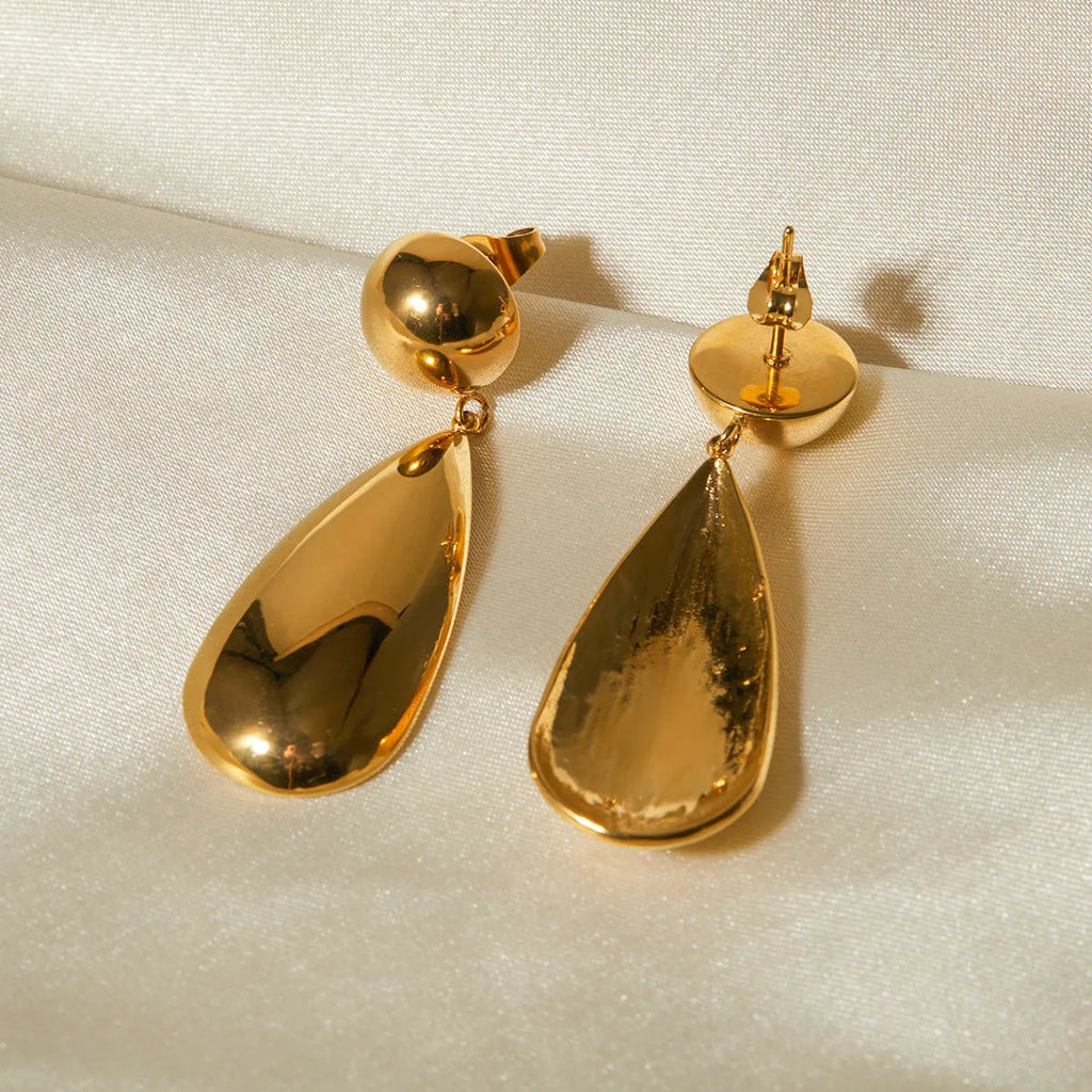 Gold coloured stainless steel earrings with geometric water drop hemisphere pendant design