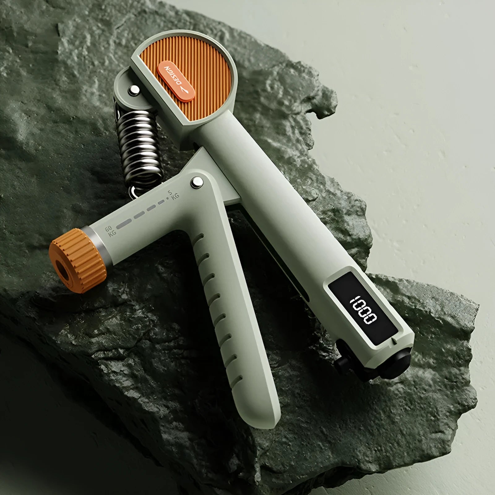 Adjustable count spring hand grip strength trainer in ivory white, black, or green.