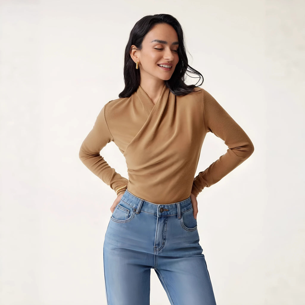 Camel-coloured slim-fit women's pullover sweater on a hanger.