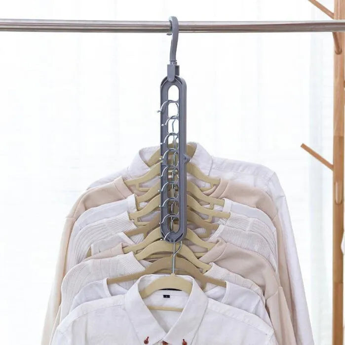 Plastic clothes hanger with 360-degree rotating hook in pink or green, measuring 33cm long