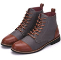 Men's black leather motorcycle boots with metal buckle detail on the side.