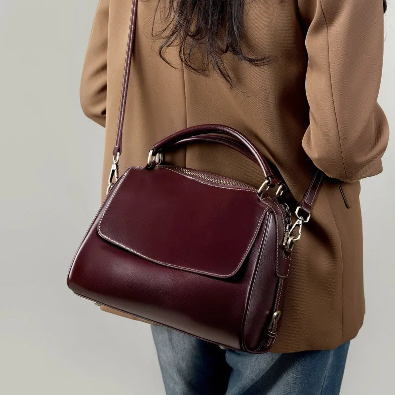 Women's soft genuine leather crossbody tote bag in a cross square shape with double straps.