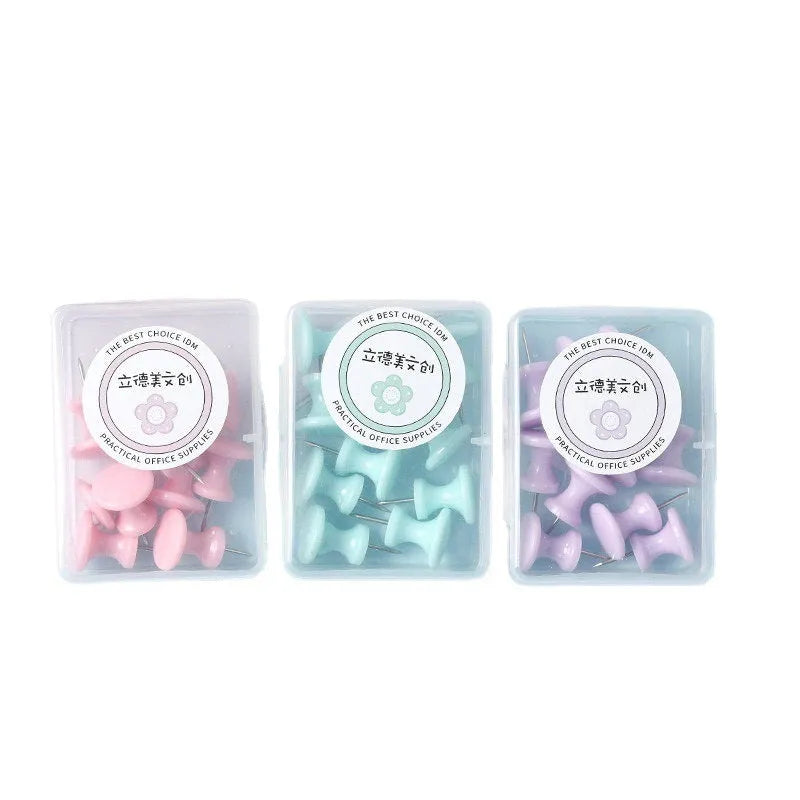 Plastic push pins in cherry blossom pink, mint green, and lavender colours, showing both large and small sizes in a box.
