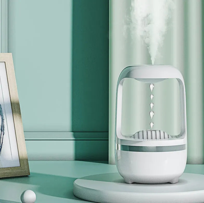 Black and white anti-gravity humidifier with floating water drops and large 500ml water tank.