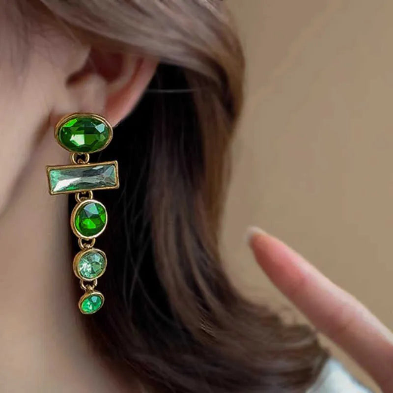 Green gradient geometric drop earrings with zircon inlays and a tassel design.